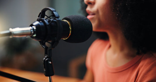 Mic, talking and woman in studio for podcast, recording broadcast and interview for radio show. 